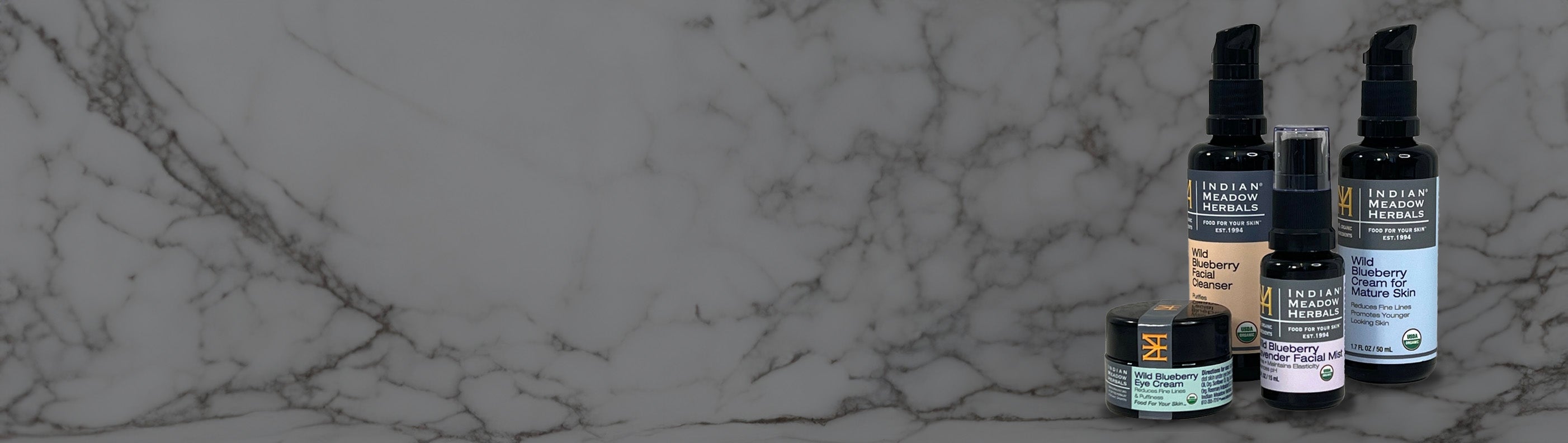 Image of 4 products included in a value pack on a marble background
