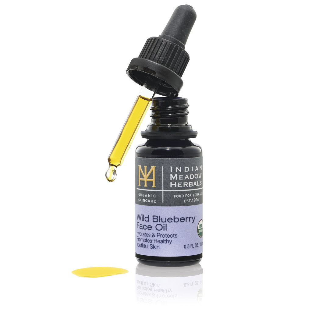 Wild Blueberry Face Oil with dropper and drop of oil